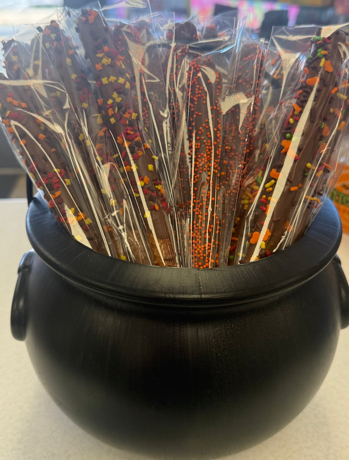 Chocolate dipped pretzel rods fall themed